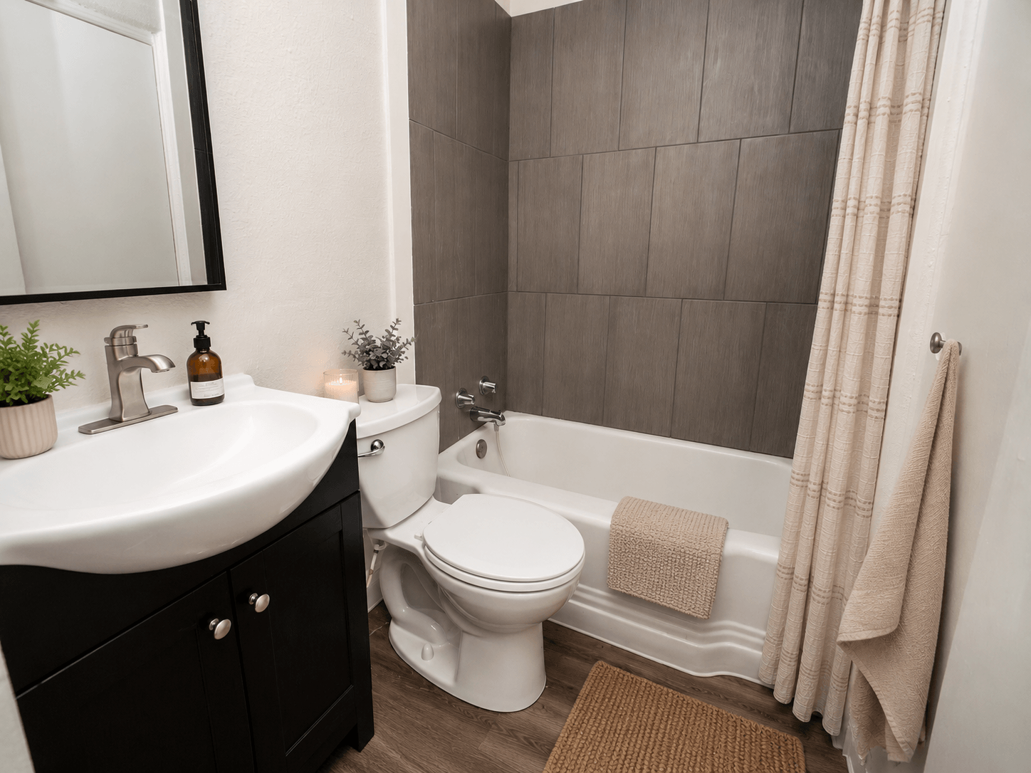 A bathroom with a white toilet and a white sink.